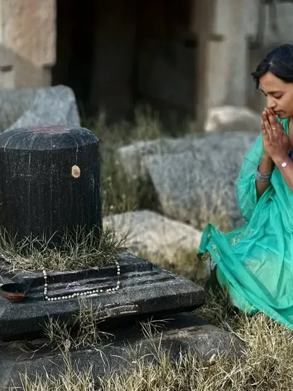 A moment of prayer and gratitude in the ruins of an old temple.