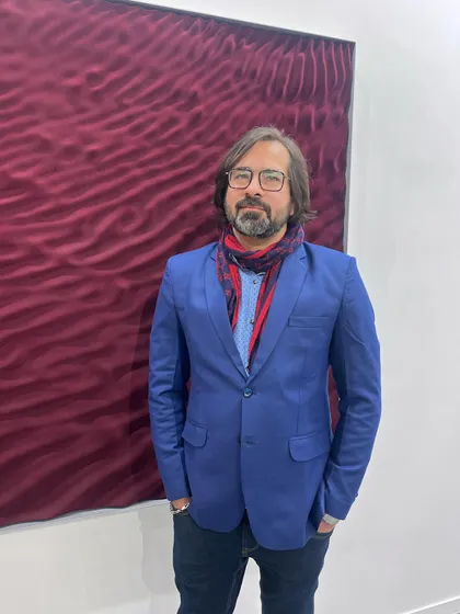 A photo of me at an art fair. These events are a great way to meet collectors and other artists and see what is happening in the contemporary art world.
