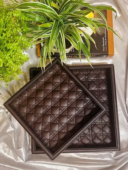 The Amadeus Bevelled Glass Trays are also available in a rich brown. The combination of the dark glass exterior and the soft, quilted leather interior is the epitome of understated luxury.