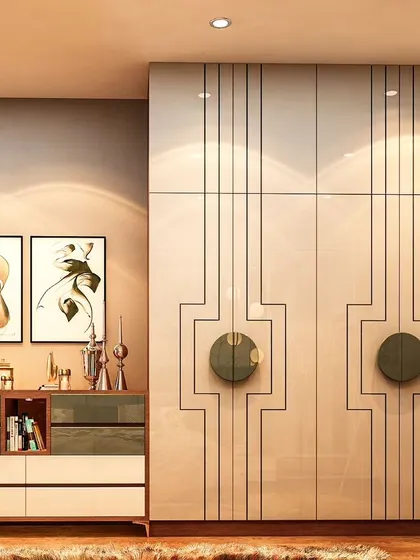 An art-deco inspired wardrobe with high-gloss doors featuring geometric line work and bold circular handles. This piece is paired with a matching chest of drawers, creating a cohesive and artistic bedroom set.