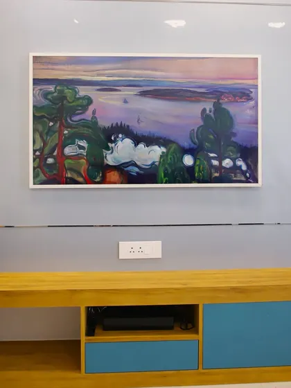 This TV doubles as a piece of art, framed to look like a painting when not in use. It's a perfect example of integrating technology seamlessly into the decor.