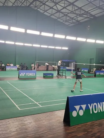 A full-court view of a singles match during the Yonex Sunrise championship hosted by us.