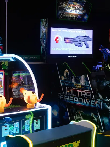 A look at our arcade corner, featuring multiple high-action games like Ultra Firepower and Zomby Wars.