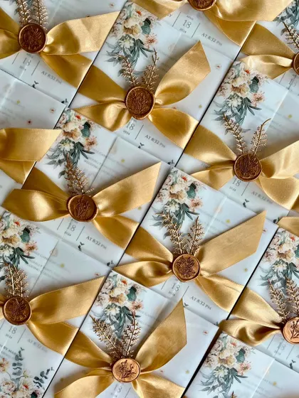 A duplicate image showing the beautifully arranged floral wedding invitations.