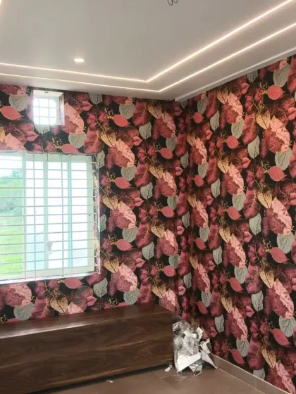 The same colorful autumn leaf wallpaper, showing how it wraps around the corner of a room.