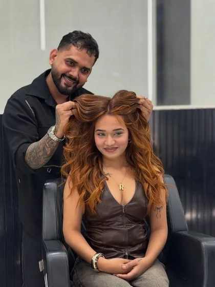A happy client showing off her new copper glow. The color adds so much warmth and personality to her look, and the voluminous styling is the perfect finish.