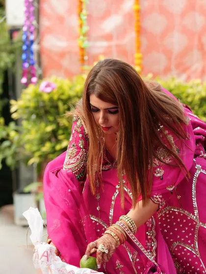 A candid shot of the client participating in the festive rituals.