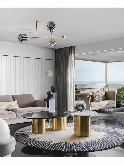 We designed this sea-facing apartment to be a story of its surroundings. The living room features custom sofas and a sculptural center table, all oriented to embrace the sprawling ocean views. The furniture is minimal yet luxurious, ensuring the focus remains on the horizon.