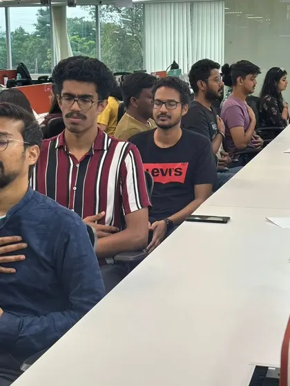 A closer look at the focused calm during our desk meditation at MagicBricks. Placing a hand on the heart and belly helps to deepen the connection to the breath and the body.