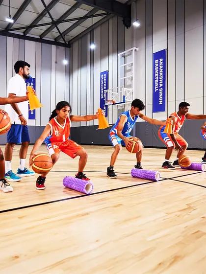 Our young stars learning ball-handling skills using foam rollers for an added balance challenge.