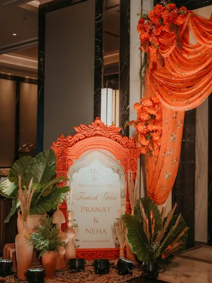 The welcome sign for the Turkish-themed Haldi, showing how we integrate decor elements like floral arrangements and drapery to create a cohesive look.