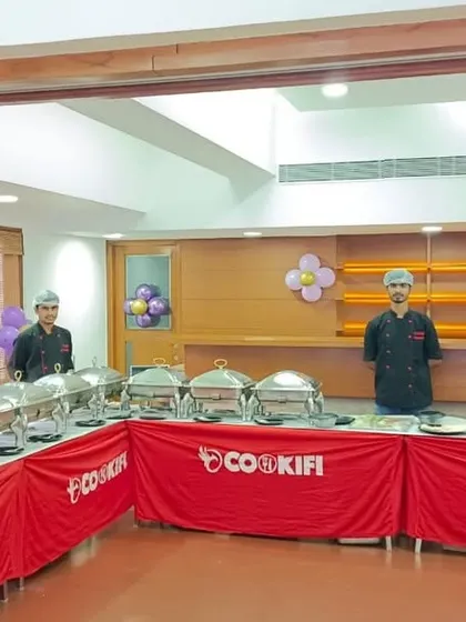 A festive birthday party setup in a clubhouse, decorated with balloons. Our team adapts to the event's theme, providing a seamless and professional catering service.