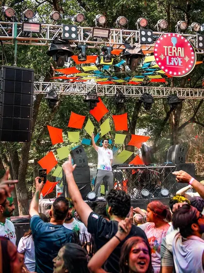 A wide shot showing the impressive stage setup and the huge crowd at the palace grounds.