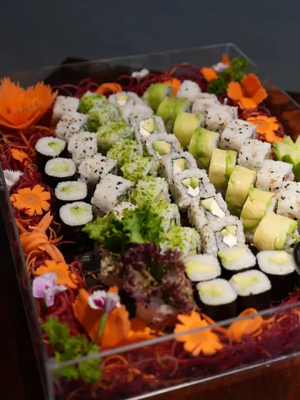 Our handcrafted vegetarian party platters are perfect for making any celebration memorable. This beautiful assortment features a variety of our creative veg rolls, from cucumber maki to avocado and cream cheese rolls, ensuring there is something for everyone.