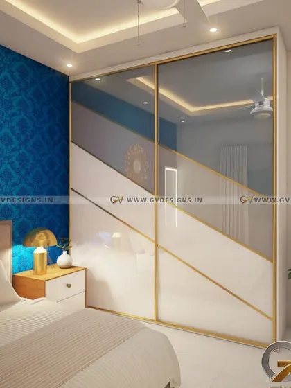 A different angle of the custom Aristo sliding wardrobe, showing how the mirrored and colored panels reflect the room's light and decor. This type of wardrobe is not just for storage; it's a statement piece that defines the room's character.