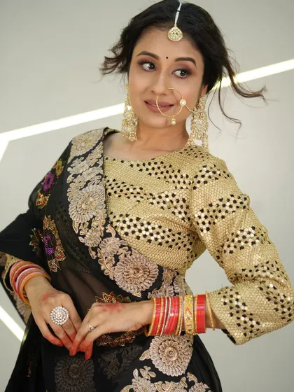Another beautiful close-up of the traditional look, highlighting the golden blouse and heavy jewelry.