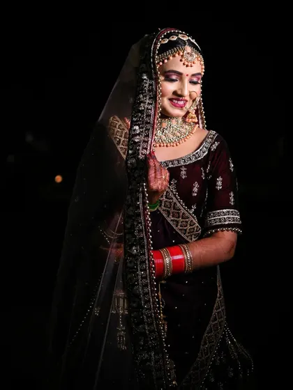 A beautiful portrait of the bride with her veil, her gentle smile and closed eyes conveying a sense of peace and happiness.