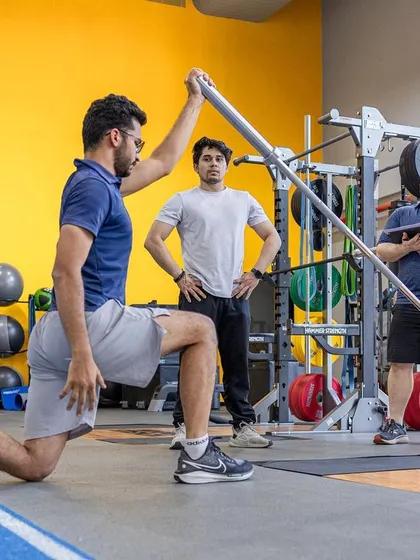 Trainees in our UKSCA course practice landmine presses, a key exercise for developing rotational power and core stability.