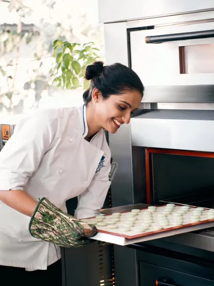 A candid shot of me baking. My journey from architecture to patisserie has been a dream, and I'm so grateful to share my passion with you.