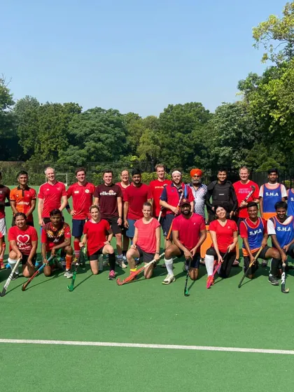 A group photo of both teams after a friendly but competitive match. These games are essential for development and team bonding.