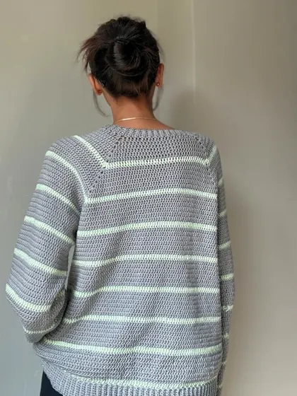 The back view of the striped sweater, showing the raglan sleeve construction which gives it a great shoulder fit.