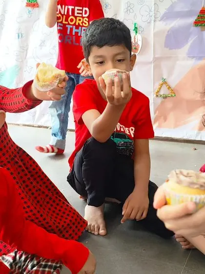 Sweet treats and happy smiles. Enjoying cupcakes during our Christmas party is a highlight for our little ones, making the celebration extra special.