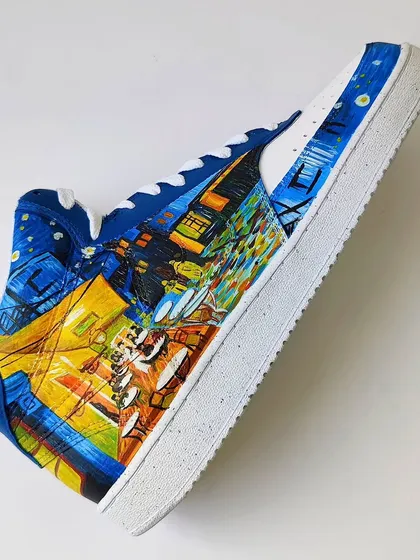 Should you wear it or frame it? This shoe features a hand-painted recreation of Van Gogh's "Café Terrace at Night." The vibrant yellows and deep blues are just mesmerizing.