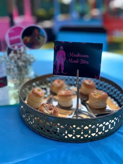 Our "Mushroom Mask Bites," or Mushroom Vol Au Vents, were served on a vintage-style platter, perfectly fitting the mysterious theme of the Squid Game party.