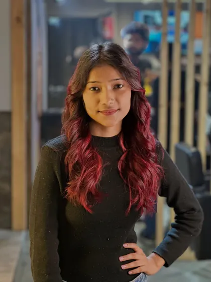 A portrait of confidence. The client looks stunning with her new red hair, which perfectly complements her style.