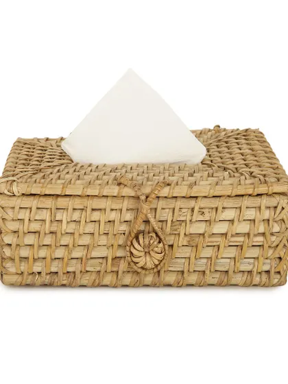 This intricately woven rattan tissue box cover features a secure loop and toggle closure. It’s a small, elegant detail that can replace plastic and add a touch of natural, handcrafted beauty to your living room, bedroom, or bathroom.