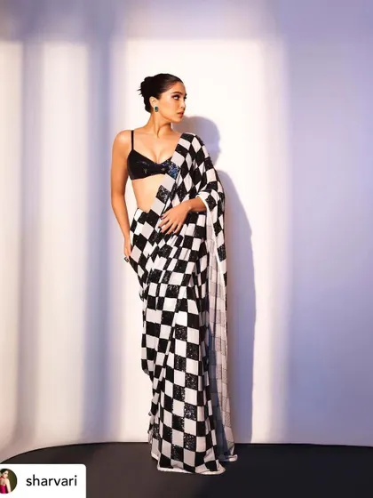 Sharvari Wagh looking chic in a modern saree by Manish Malhotra. The makeup is sharp and defined, with a strong focus on the eyes to match the graphic pattern of the outfit.