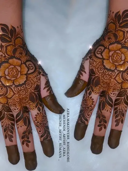 This non-bridal design features shaded roses and leaves, with the couple's initials subtly included.