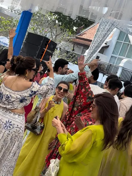 Guests enjoying the daytime wedding party in Phuket. The vibe was relaxed but the music kept everyone moving.