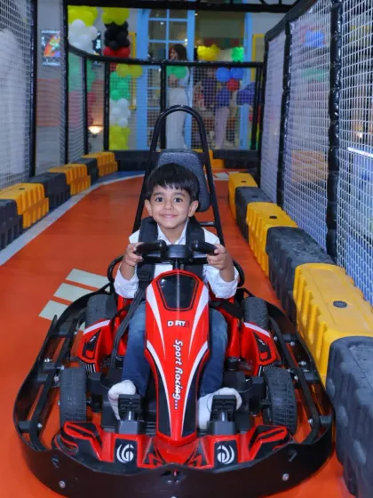 With a confident smile, this driver is prepared for a fun lap around the Wobble World racetrack.