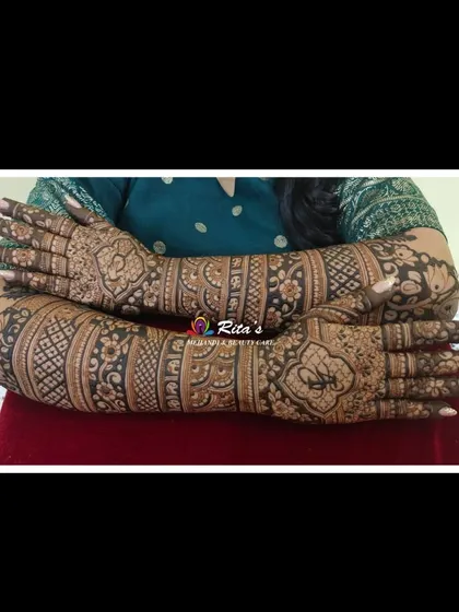 The back of the hands, showing a full-coverage design that is both traditional and elegant, perfect for a bride.