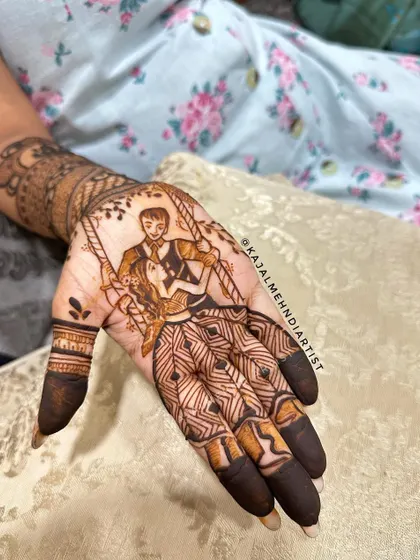 Another beautiful couple on a swing, this time with a rich, dark henna stain. The contrast between the detailed figures and the geometric patterns on the fingers creates a balanced and stunning look.