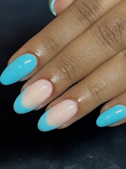 This blue French tip design is perfect for adding a pop of color to your look.