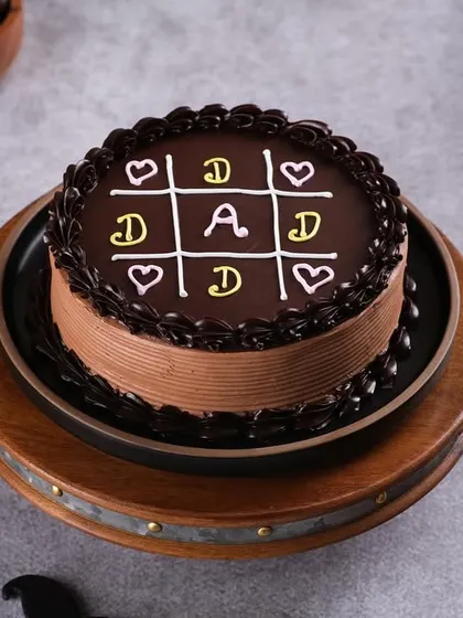 A fun and playful "Tic Tac Toe" cake for Dad. This creative design is a sweet way to challenge him to a game he's guaranteed to win.