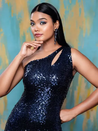 Another look at the beautiful navy sequin dress, a versatile option for various evening events.