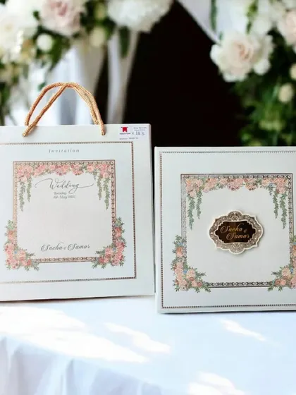 I love creating coordinated wedding stationery. This set includes a beautiful floral invitation box with a custom nameplate, along with a matching carry bag to present it to your guests in style.