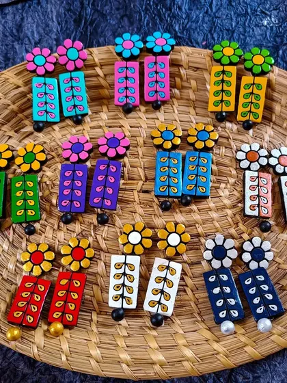 My floral creeper earrings are long, elegant, and come in many different color palettes. They are perfect for adding a touch of nature-inspired beauty.