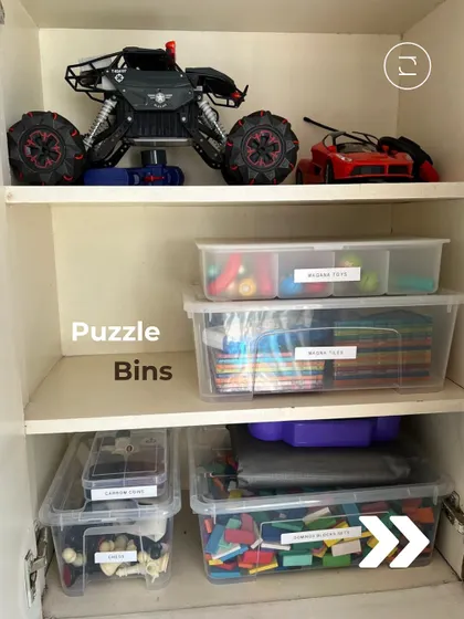 Puzzles and building blocks are stored in clear, labeled bins. This not only keeps all the small pieces together but also makes it simple for kids to find the specific set they want to play with.