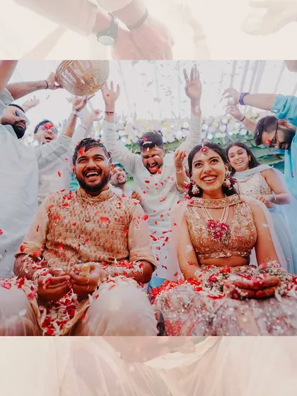 A creative edit of the couple being showered in petals, capturing the vibrant and celebratory atmosphere of their Haldi ceremony.