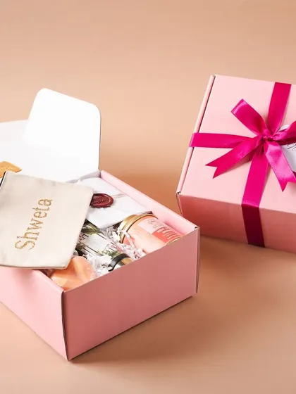 One box open and one box closed. This shot shows the full experience, from the beautiful exterior to the personalized treasures inside.