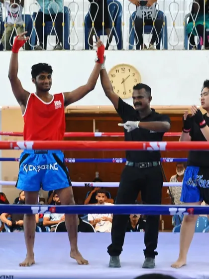 A fighter celebrates his win at the K1 kickboxing event. Every victory is a victory for the whole team.