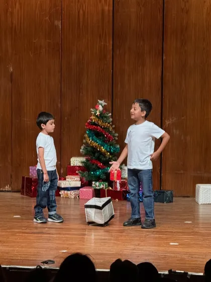A dramatic moment between two actors, showcasing their ability to convey emotion and story.