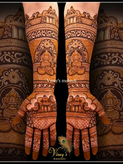 An intricate design for the groom's sister, filled with traditional motifs like kalash pots and palace architecture.