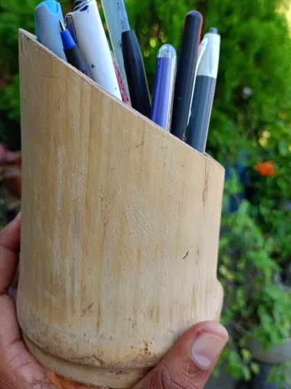 A simple yet effective desk accessory, this pen holder is crafted from a single piece of solid bamboo. It's a small but tangible way to introduce sustainability into the workspace.