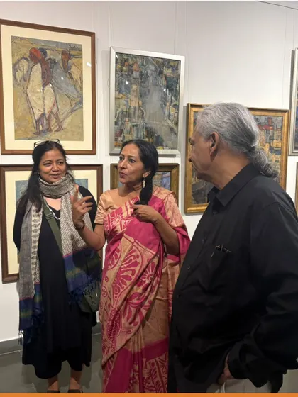 Visitors discussing the artworks at the Vidya Bhushan preview night.