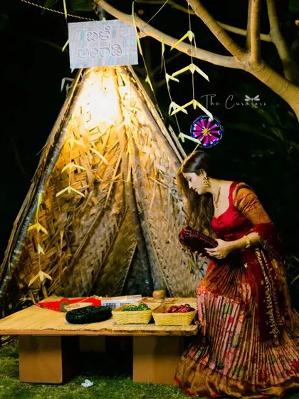 A guest selecting bangles at our interactive 'Balle Angadi' booth. This element brought a piece of traditional market culture to the party, delighting guests of all ages.